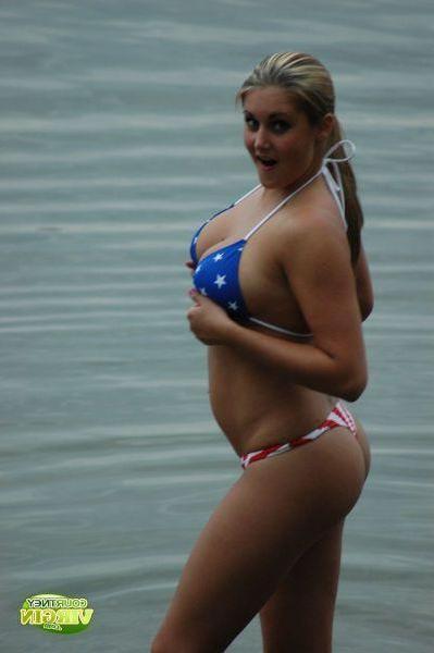 16P Pictures of Courtney Virgin going for a swim in her USA bikini