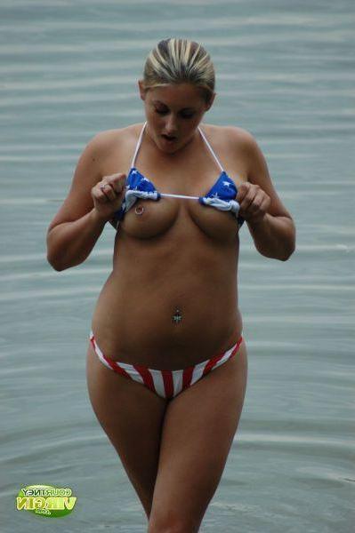 16P Pictures of Courtney Virgin going for a swim in her USA bikini
