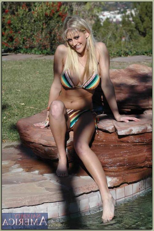 16P Busty blonde Eve Laurence strips from bikini and spreads shaved slit