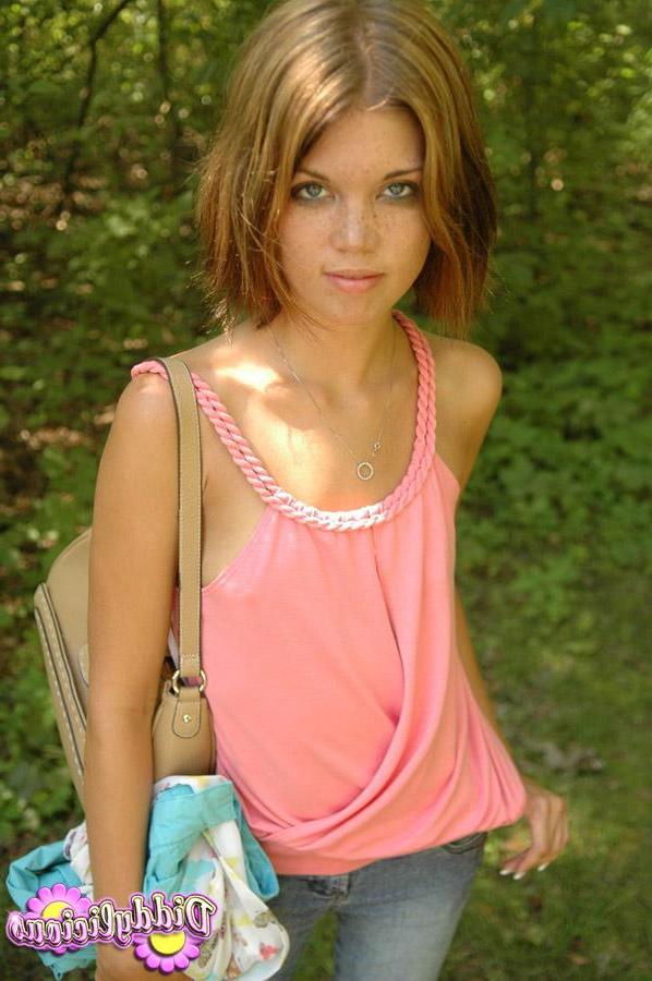 12P Brunette teen Diddy teases in her pink tank top and jeans in the woods