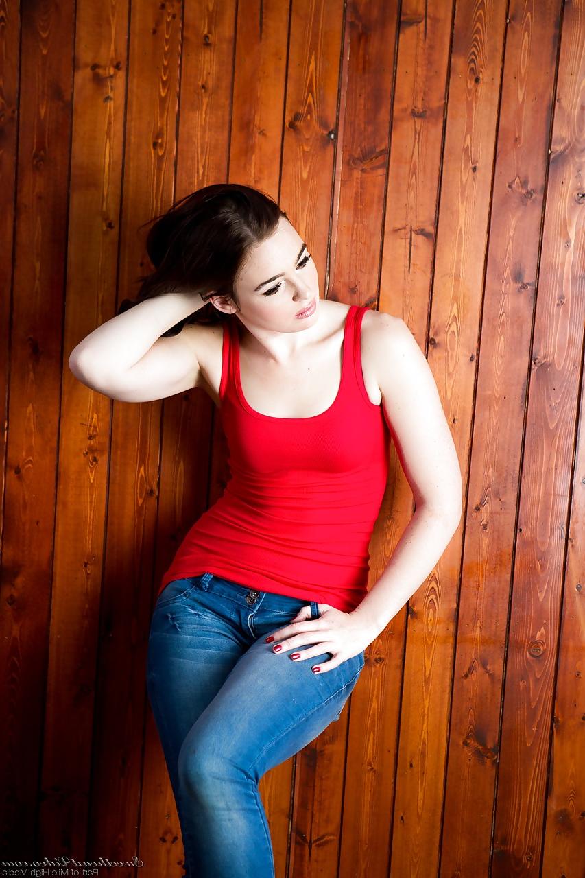 15P Brunette Jodi Taylor in jeans undressing to show hard nipples & bald pussy