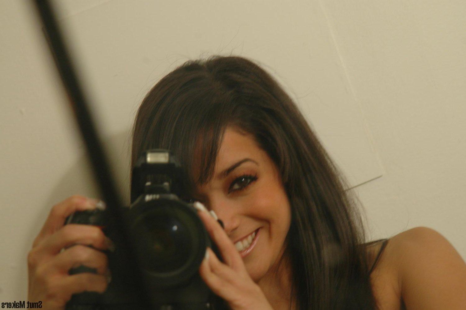 15P Ivy Black poses for the camera in a grungy bathroom