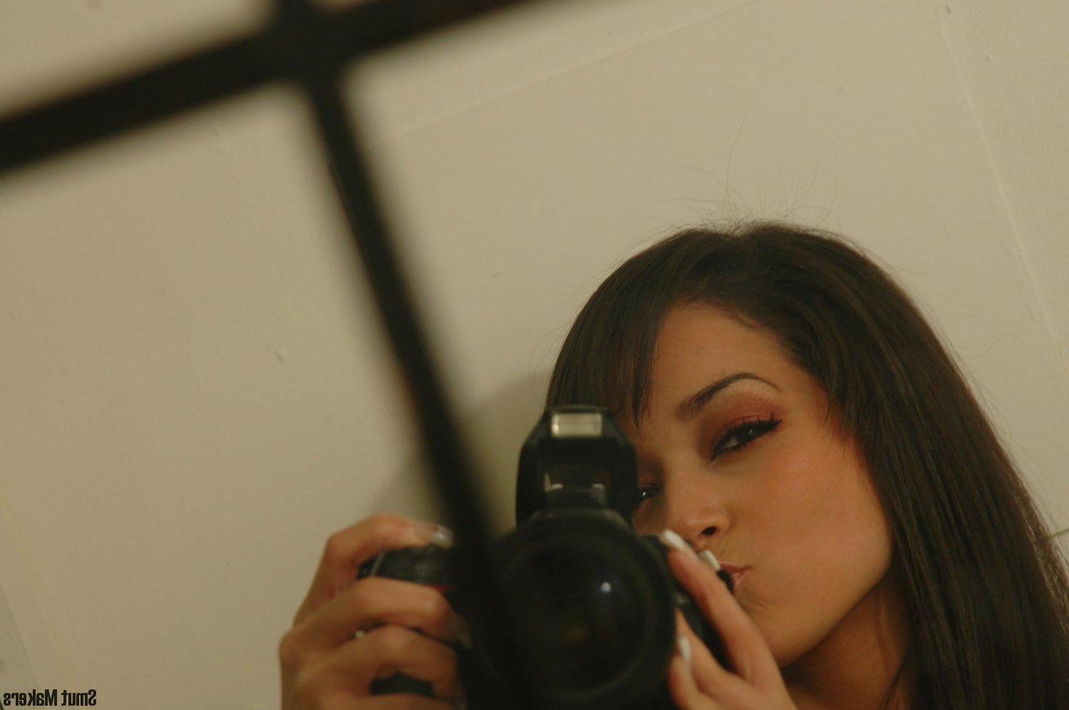 15P Ivy Black poses for the camera in a grungy bathroom