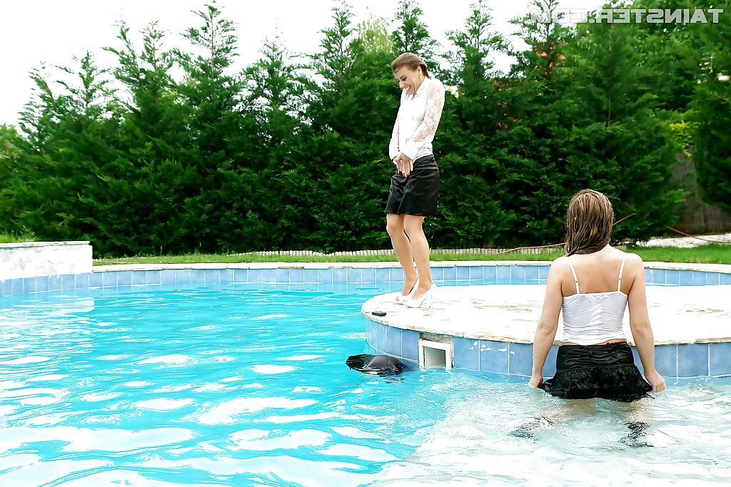 16P Nikky Thorne has some wet fully clothed pool fun with her lesbian friend