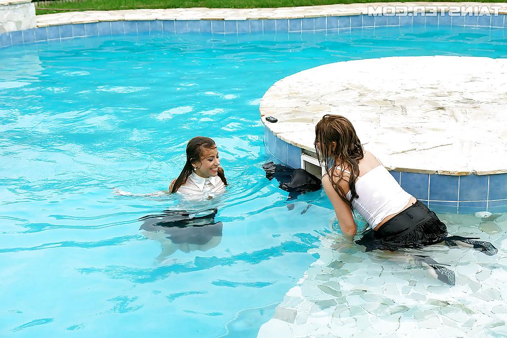 16P Nikky Thorne has some wet fully clothed pool fun with her lesbian friend