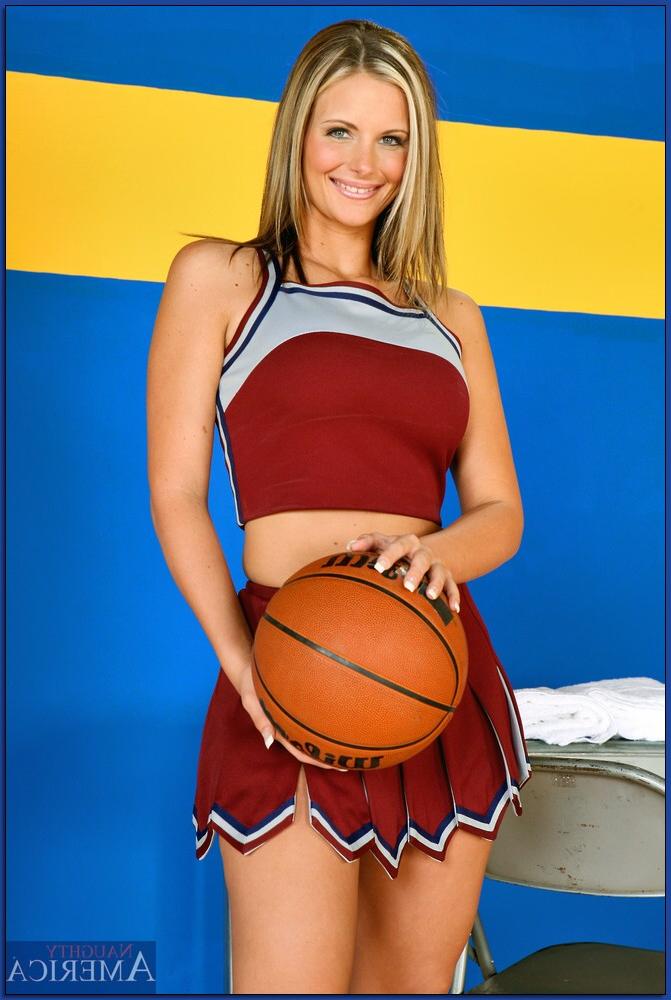 16P Enchanting cheerleader Phoenix Marie posing solo with bare boobs and ass