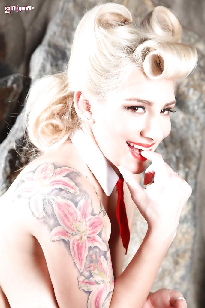 16P Blonde babe September Carrion poses solo for topless glamour shoot