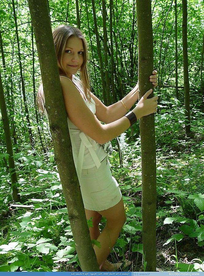 20P Pictures of Josie Model showing her tits in the woods