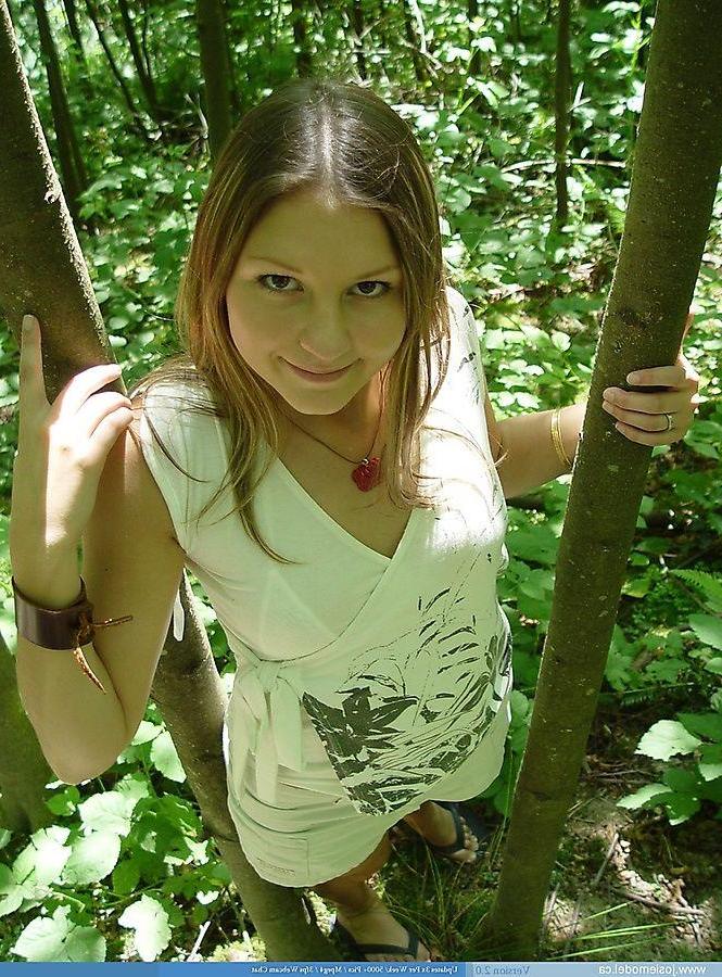 20P Pictures of Josie Model showing her tits in the woods