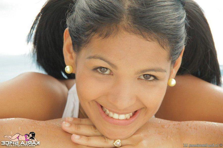 15P Pictures of Karla Spice wearing cute pigtails and a sexy bikini