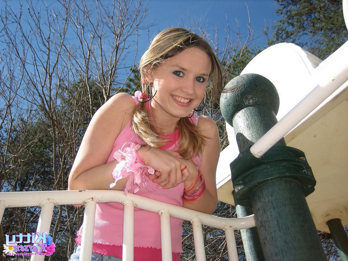 20P Pictures of teen star Kitty Karsen giving you some upskirt shots outside