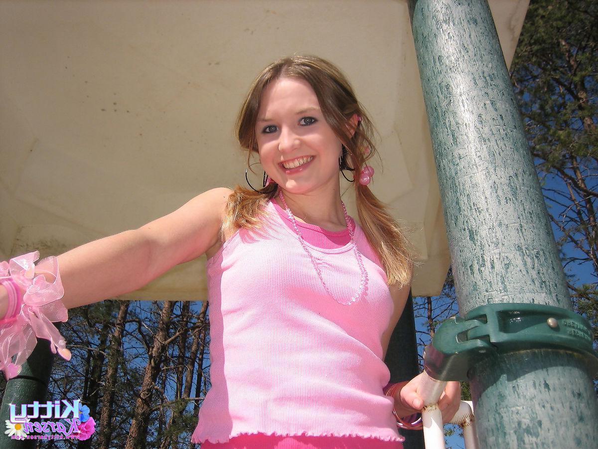20P Pictures of teen star Kitty Karsen giving you some upskirt shots outside