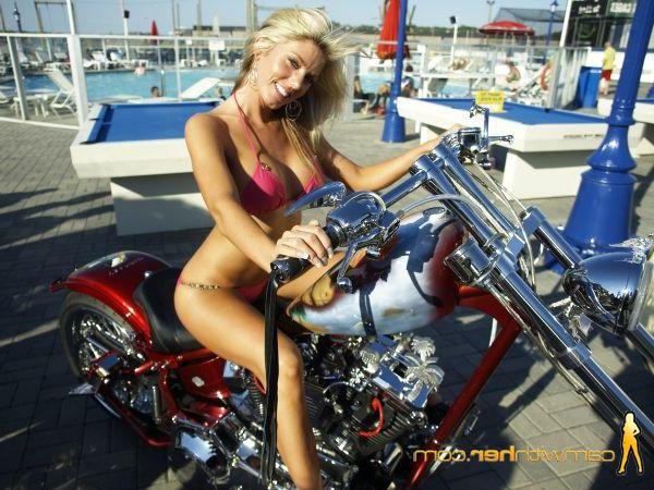 12P Blonde model Kyra poses on a bike in her bikini