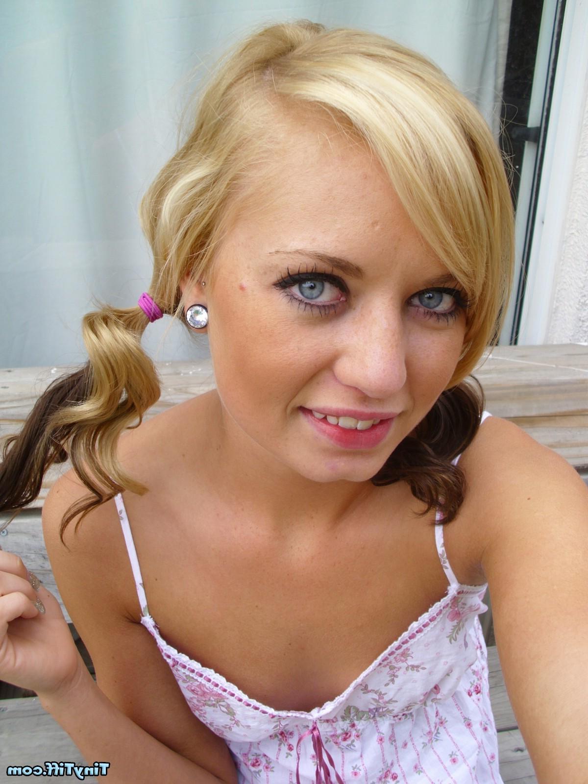 16P Tiny Tiff poses in pigtails and shows you up her skirt