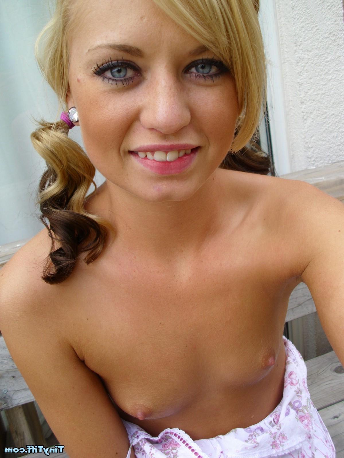 16P Tiny Tiff poses in pigtails and shows you up her skirt