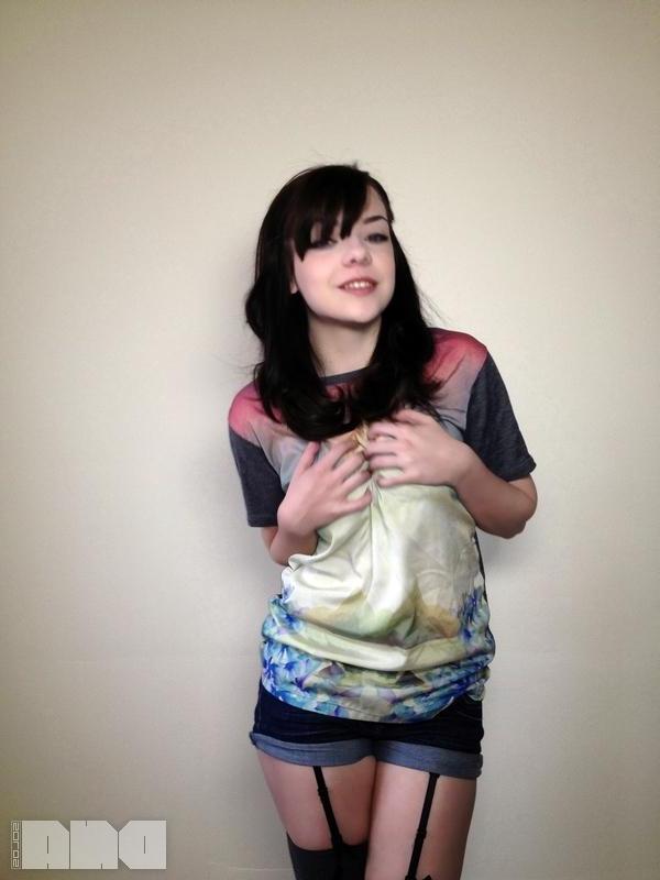 15P Pretty alt model Lilly Rose gives you a striptease next to the wall