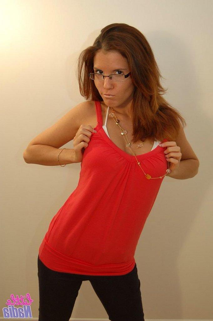 15P Pictures of teen babe Little Nadia teasing in a bikini