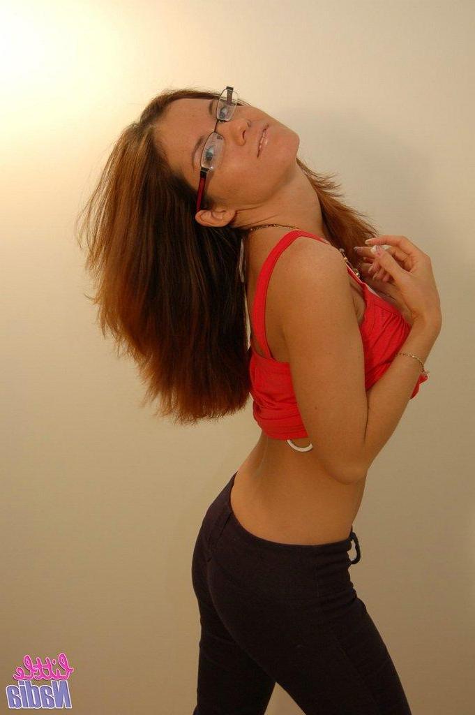 15P Pictures of teen babe Little Nadia teasing in a bikini