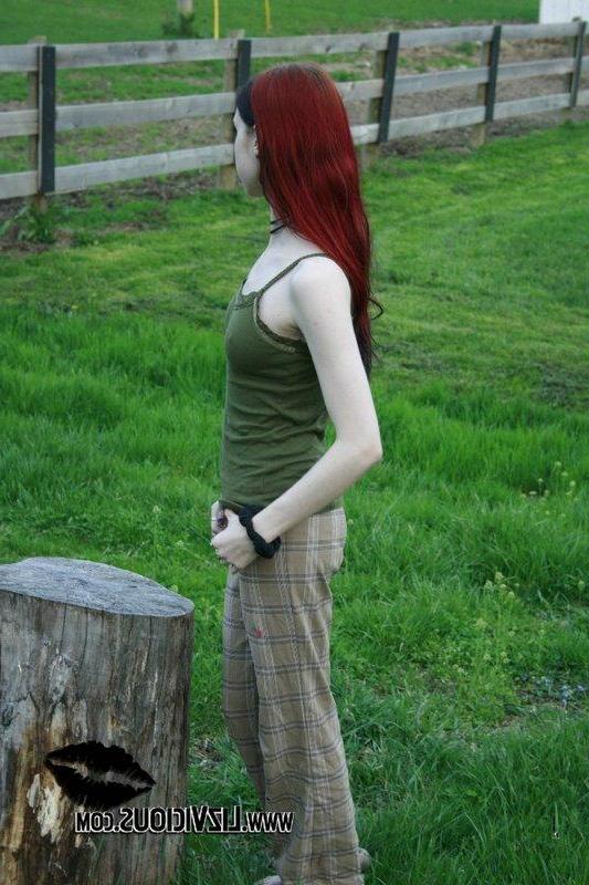 20P Liz Vicious strips slowly on a farm