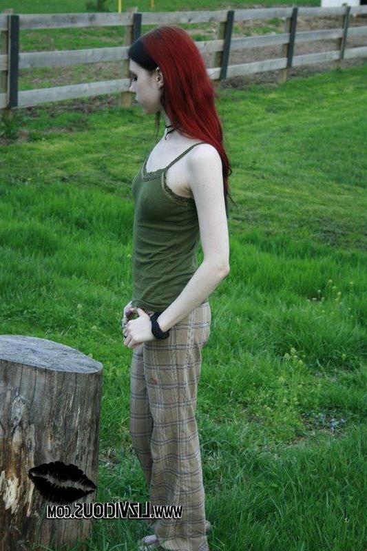 20P Liz Vicious strips slowly on a farm