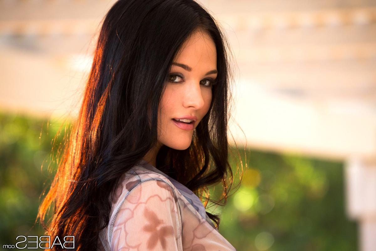 14P Brunette beauty Logan Drae fingers her tight pussy outside