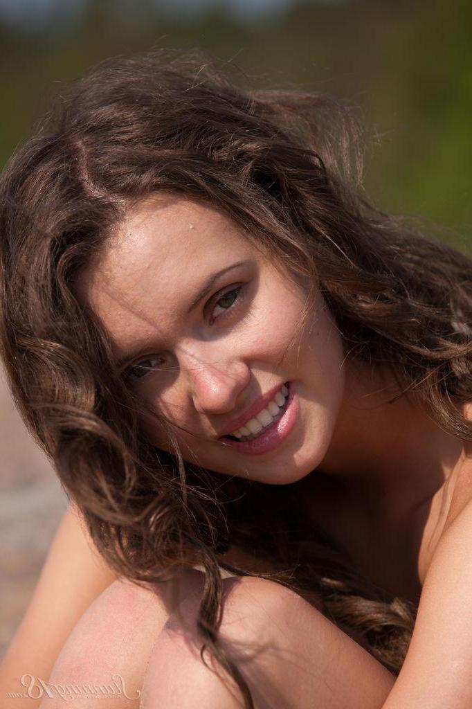 16P Brunette teen Lucy G strips out of her bikini on the rock