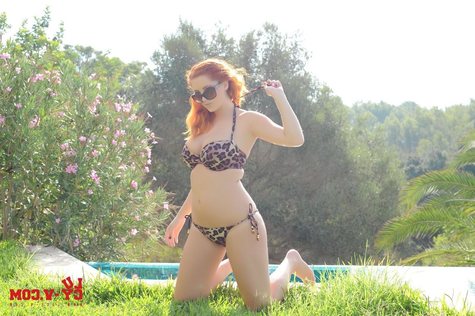 12P Pictures of Lucy V stripping her leopard spot bikini by the pool