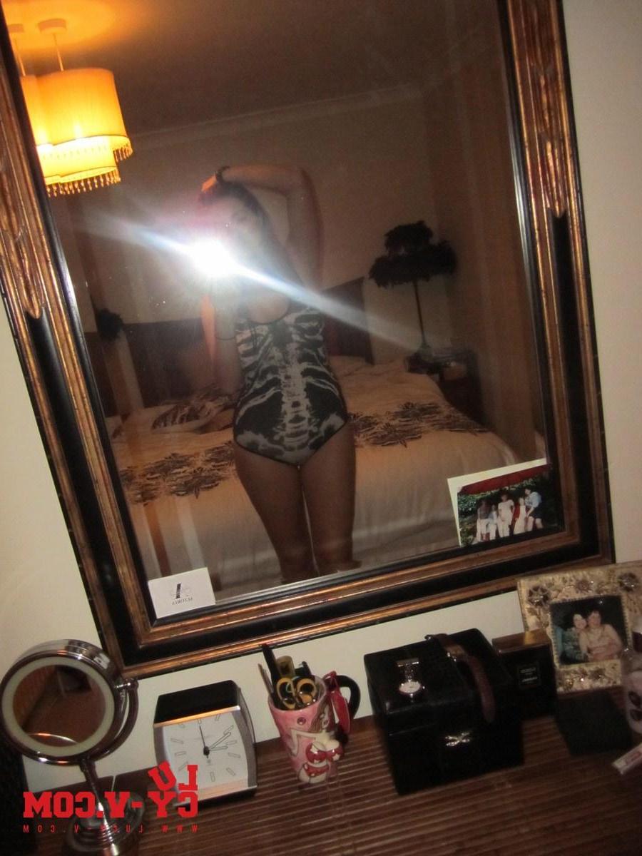 12P Lucy V pulls down the top of her tight one piece