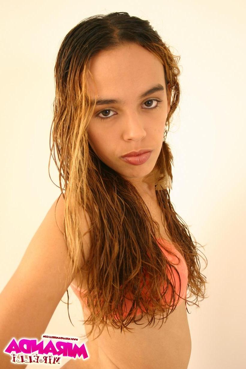 16P Skinny Miranda Mirelli teases in her peach panties, giving peeks at her landing strip