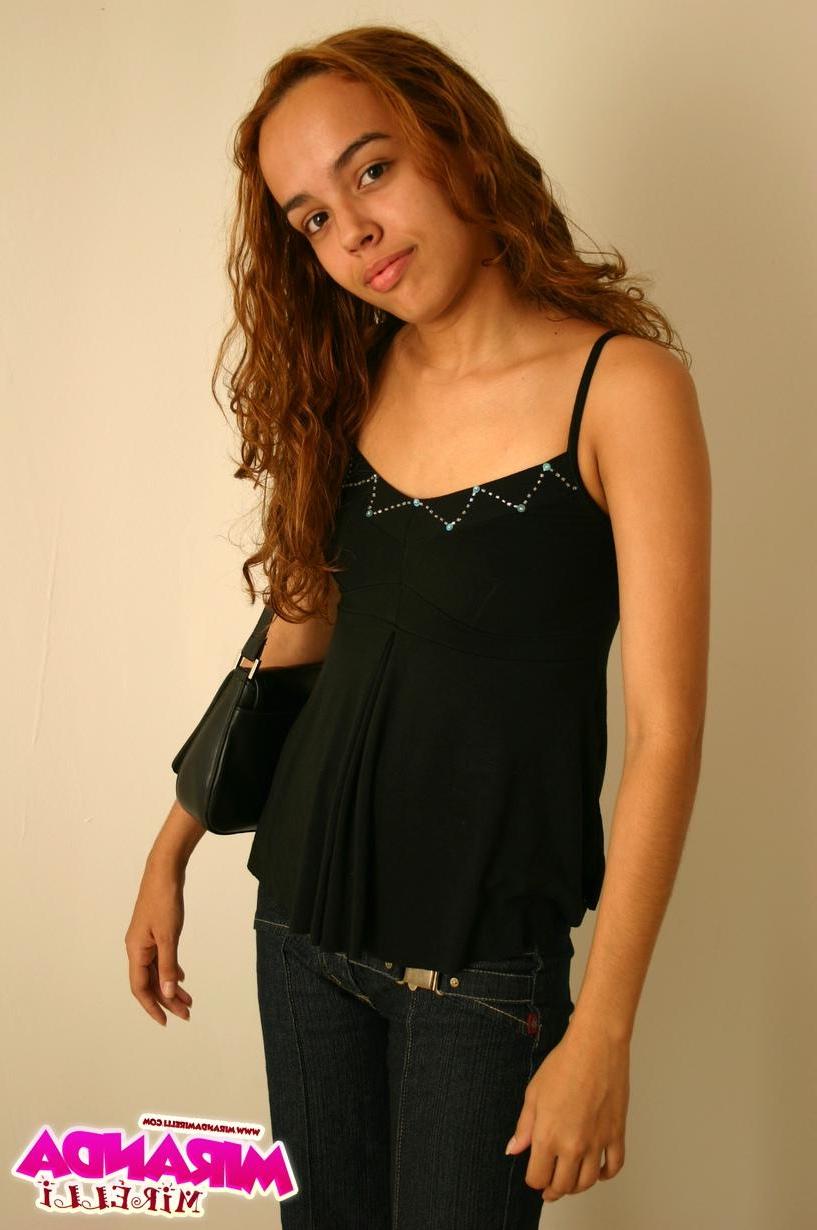 16P Miranda poses in a black top and jeans
