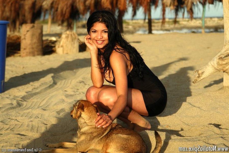 15P Natalia Spice shows off her sweet beach body when she slips out of her bikini