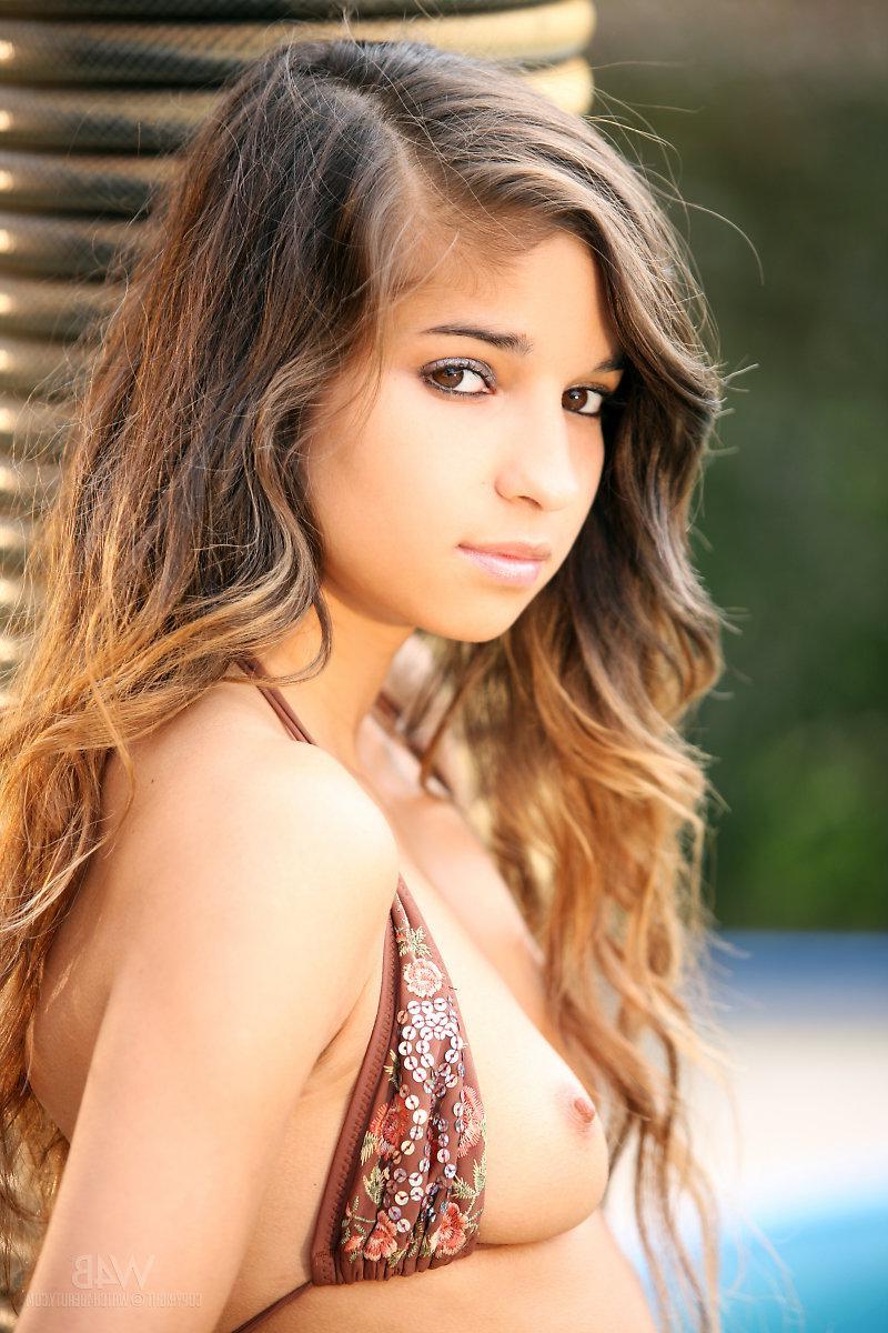 16P Beautiful brunette teen Nika strips out of her bikini and spreads her legs