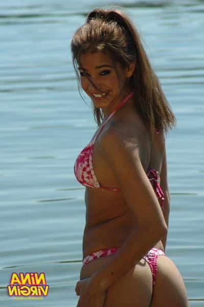 20P Pictures of teen chick Nina Virgin looking hot in a bikini
