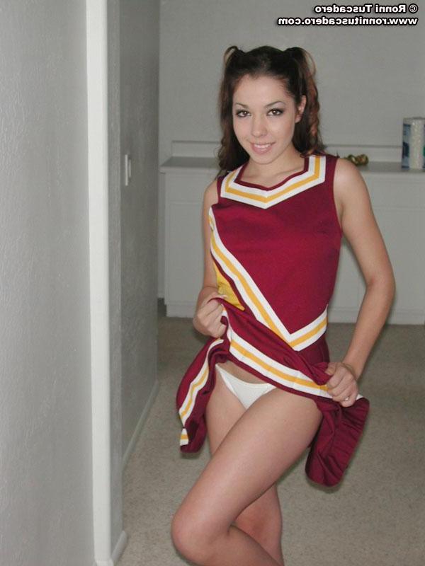 20P Pictures of two teen cheerleaders practicing their moves outside