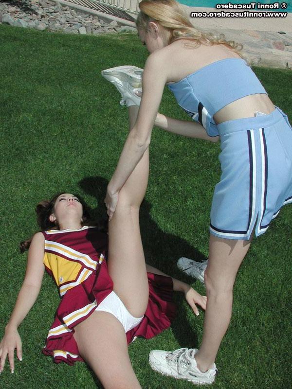 20P Pictures of two teen cheerleaders practicing their moves outside