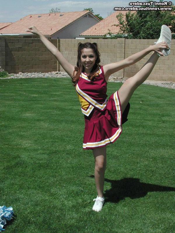 20P Pictures of two teen cheerleaders practicing their moves outside