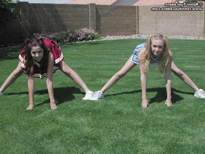 20P Pictures of two teen cheerleaders practicing their moves outside
