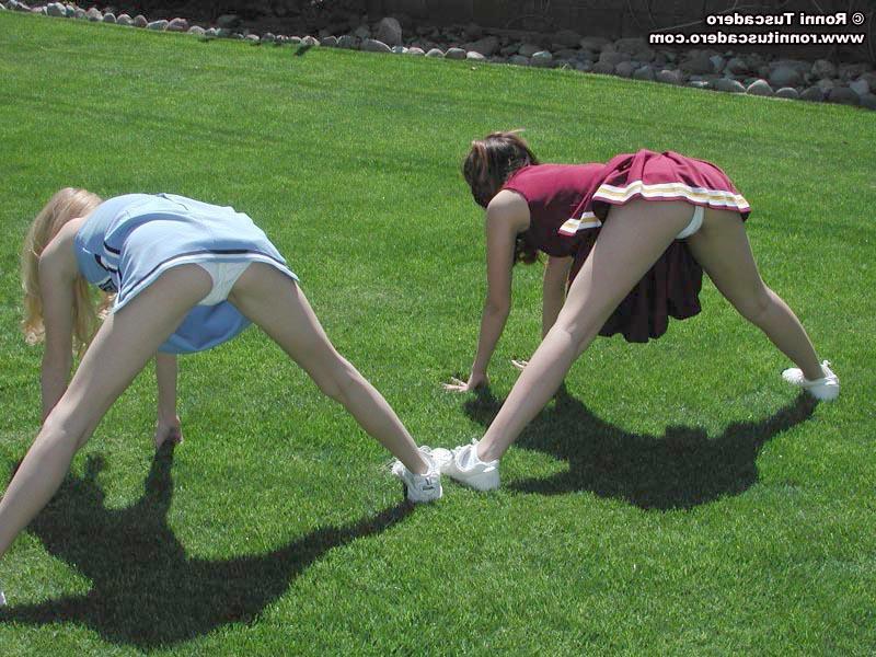 20P Pictures of two teen cheerleaders practicing their moves outside