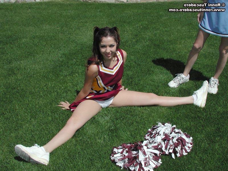 20P Pictures of two teen cheerleaders practicing their moves outside