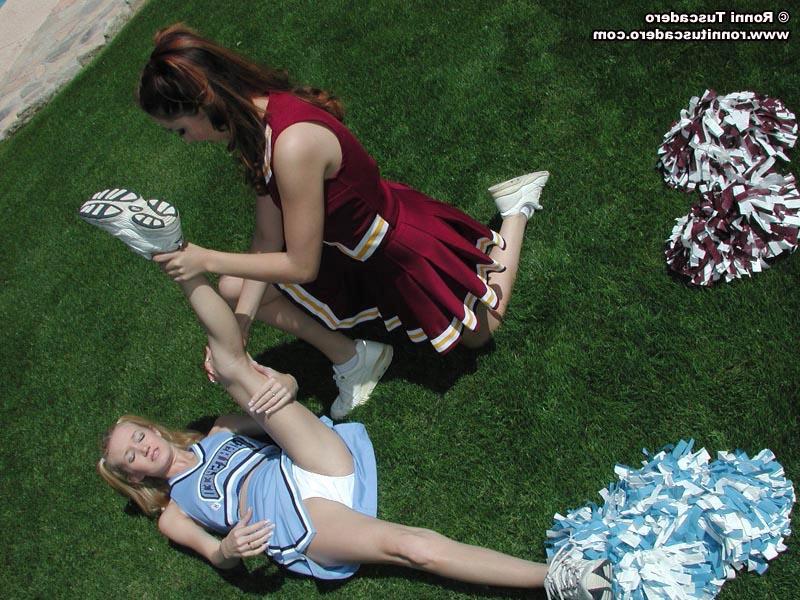 20P Pictures of two teen cheerleaders practicing their moves outside