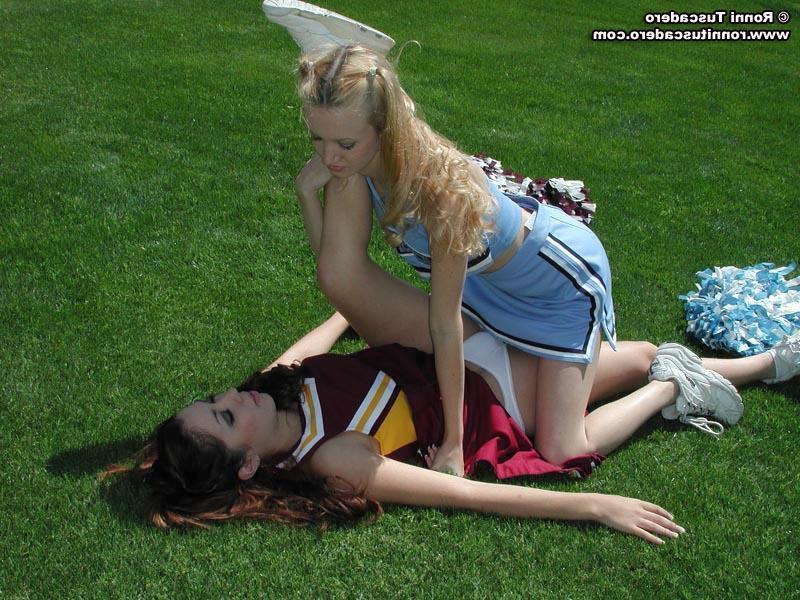 20P Pictures of two teen cheerleaders practicing their moves outside