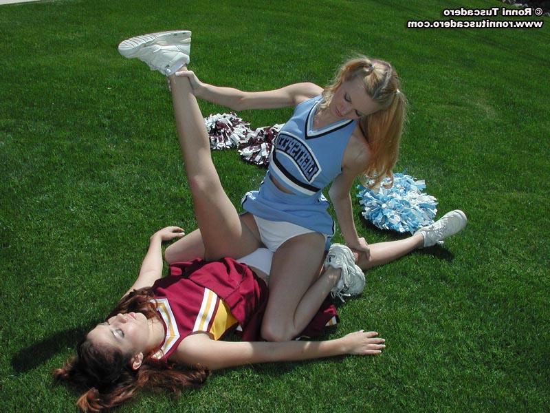 20P Pictures of two teen cheerleaders practicing their moves outside