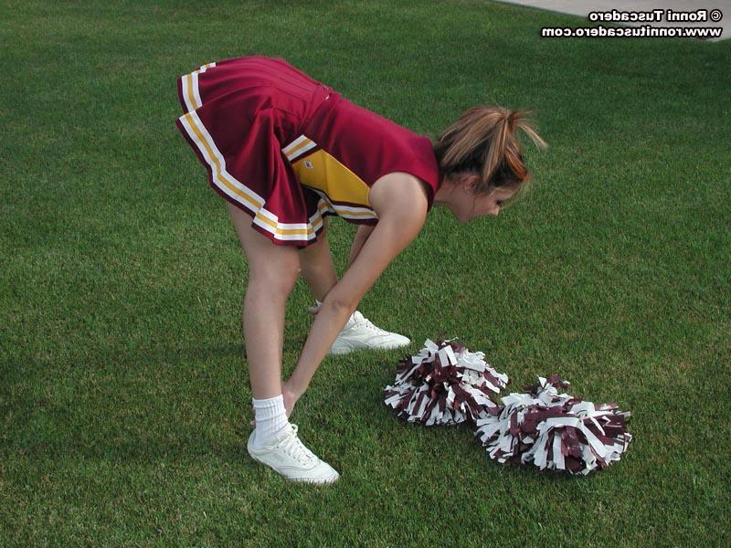 20P Pictures of a hot teen cheerleader stripping outside