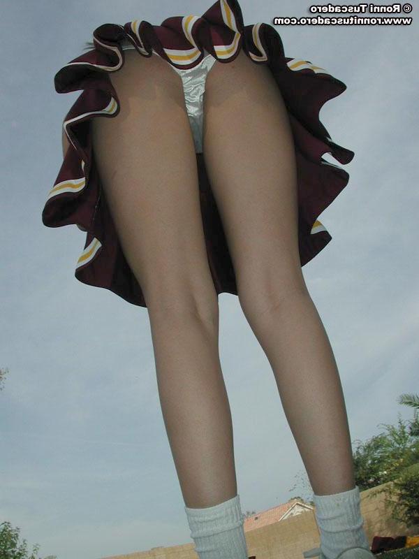 20P Pictures of a hot teen cheerleader stripping outside