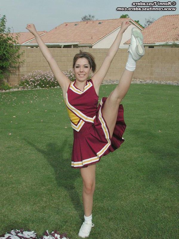 20P Pictures of a hot teen cheerleader stripping outside