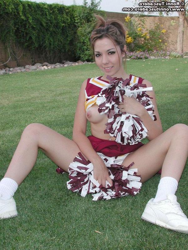 20P Pictures of a hot teen cheerleader stripping outside
