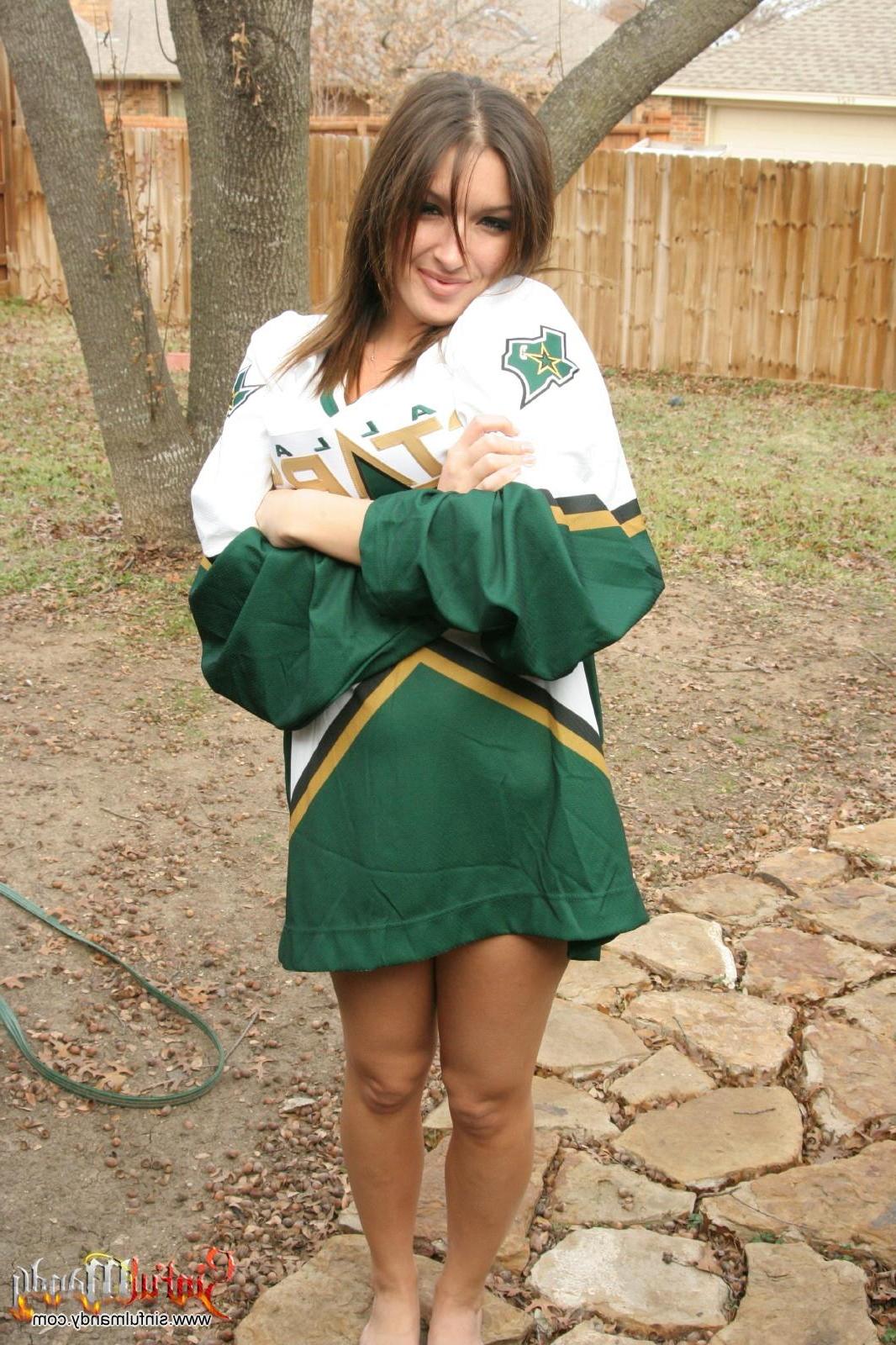 16P Pictures of Sinful Mandy stripping out of her cheerleader outfit in the back yar