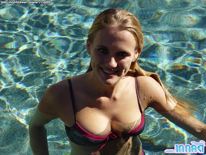 15P Pictures of teen model Sweet Danni hanging out by the pool