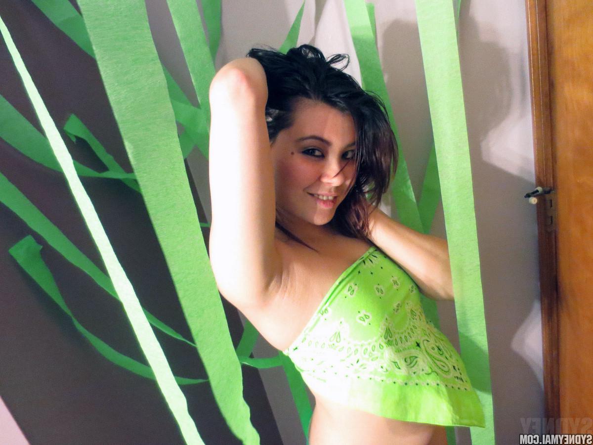 15P Hot asian girl Sydney Mai does a sexy striptease in green