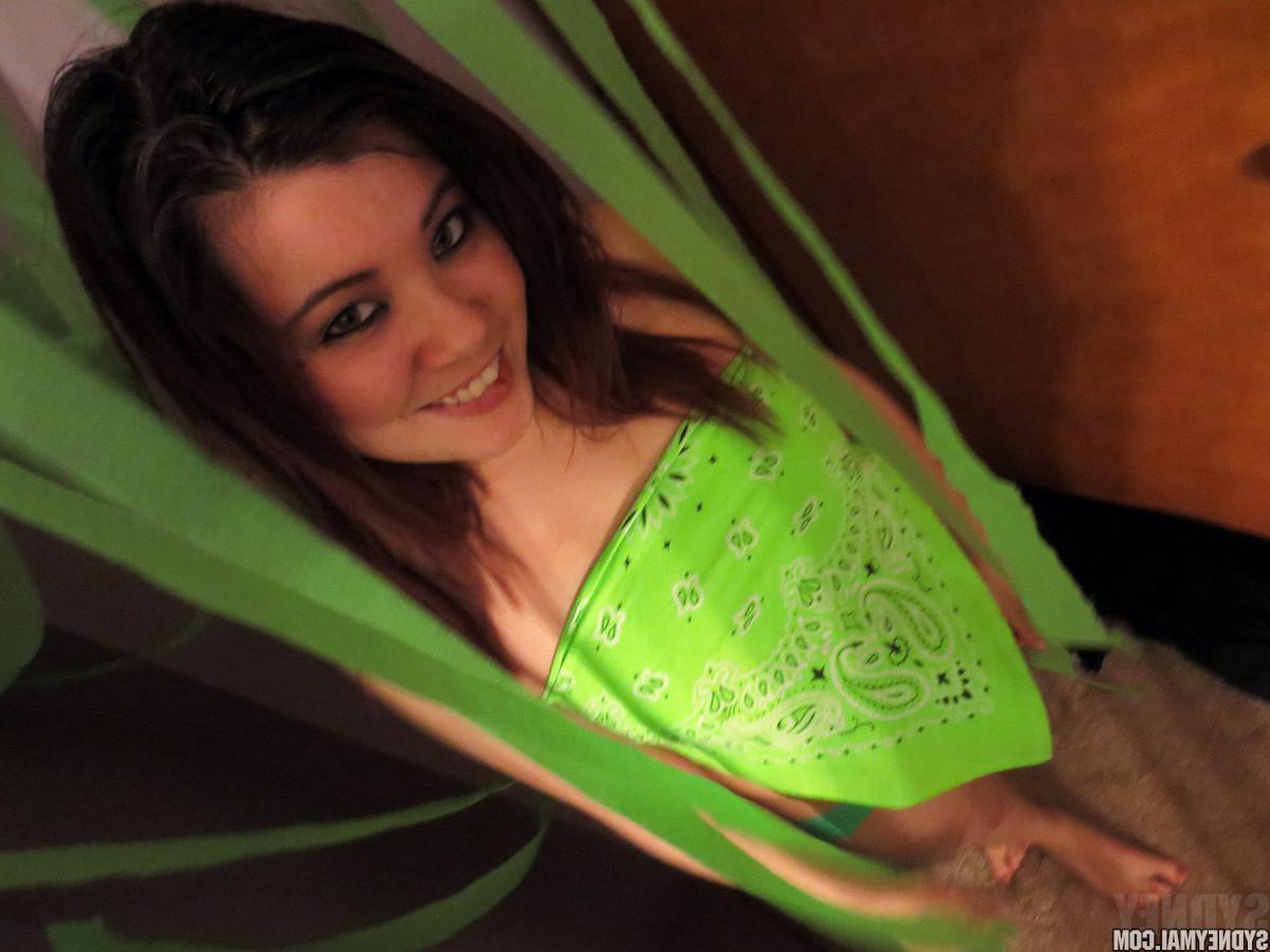 15P Hot asian girl Sydney Mai does a sexy striptease in green